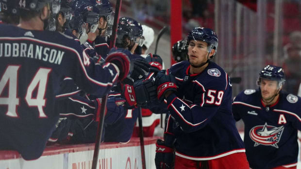 Oct 3, 2022; Raleigh, North Carolina, USA; Columbus Blue Jackets right wing Yegor Chinakhov (59) celebrates his goal against the Carolina Hurricanes during the first period at PNC Arena. Mandatory Credit: James Guillory-USA TODAY Sports